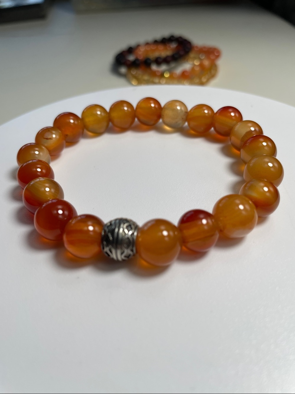 Natural Carnelian Beaded Stretch Bracelet with Detailed Silver Accent.